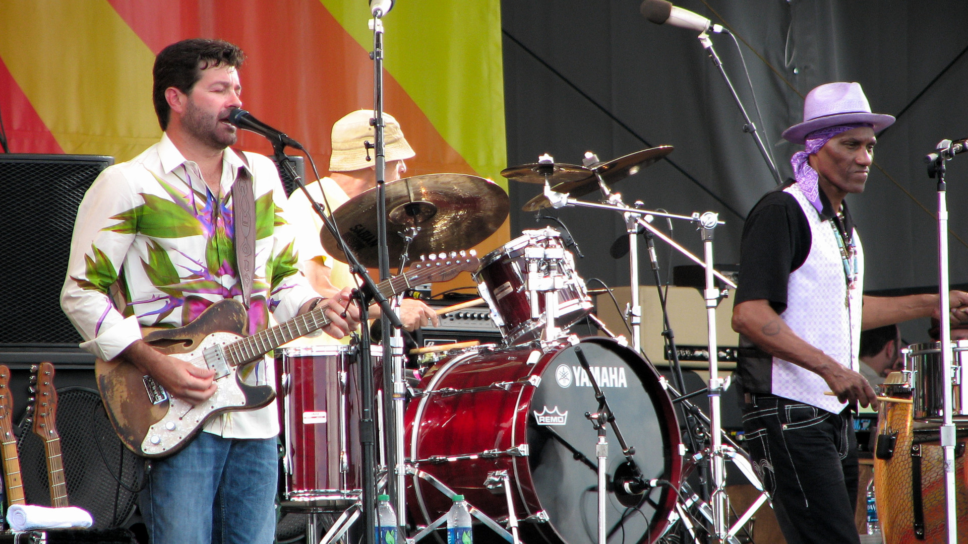 Tab Benoit on guitar, Johnny Vidacovich on drums, and Cyrille Neville, percussion and vocals