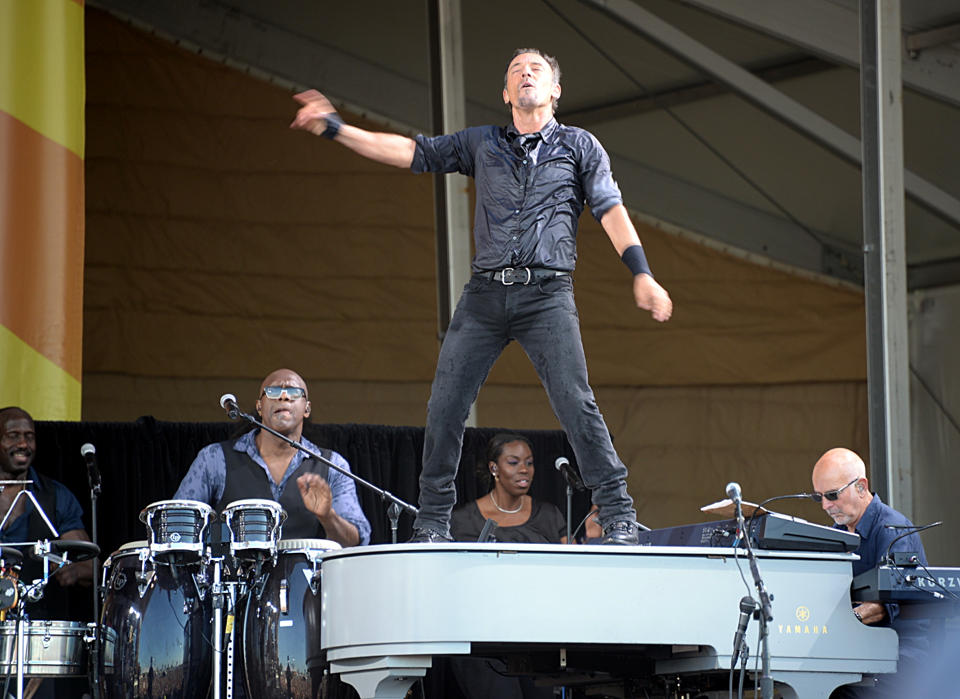 Bruce atop Roy Bittan's piano